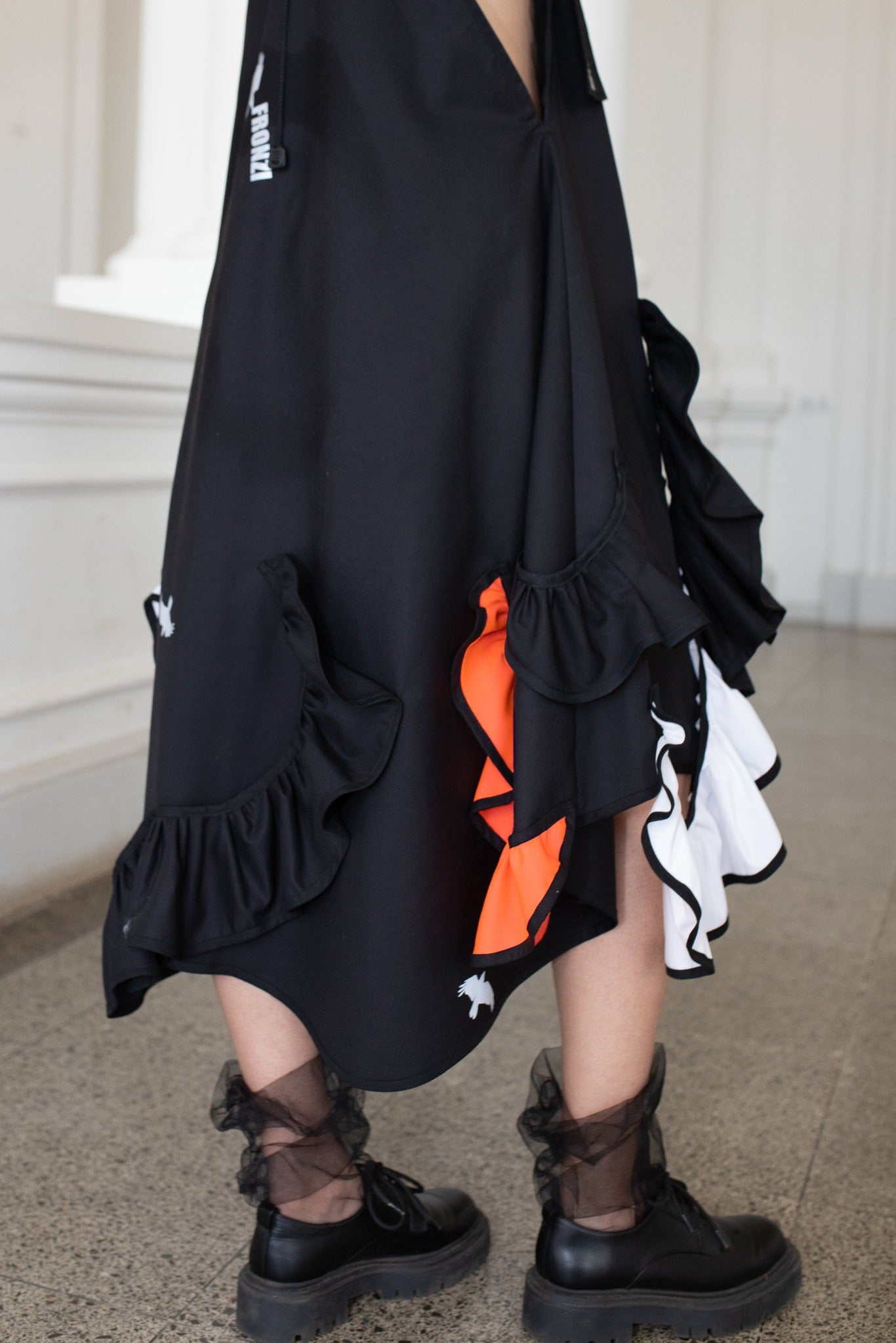 Black fronzi dress with orange and white frills