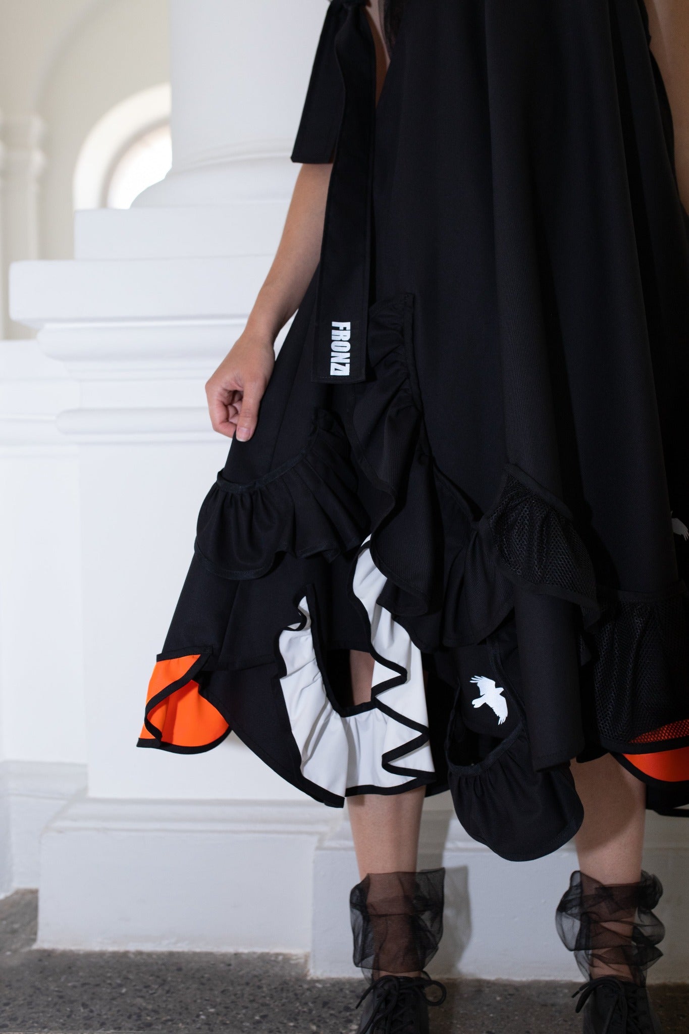 Black fronzi dress with orange and white frills