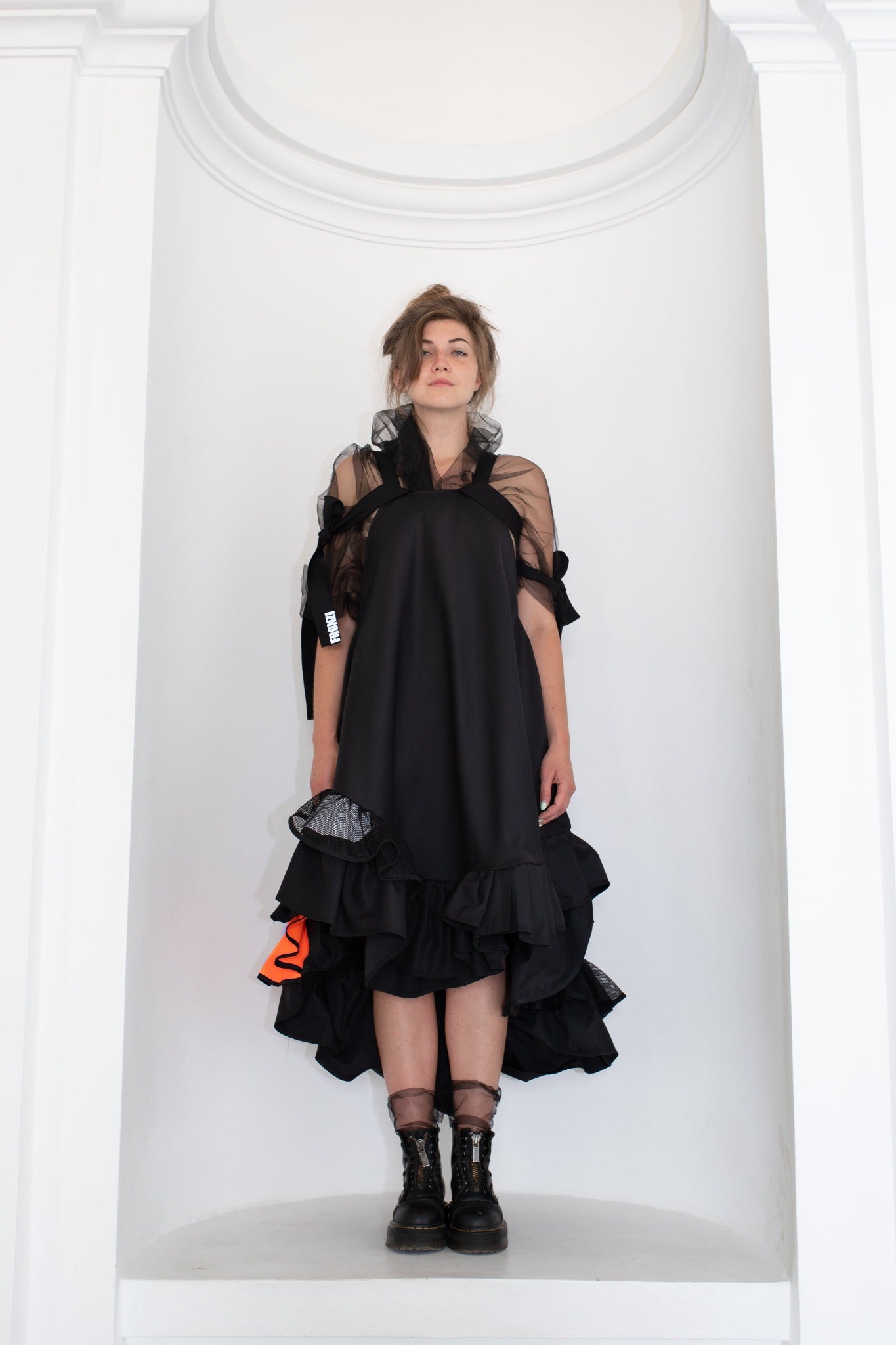 Black fronzi dress with orange details and frills