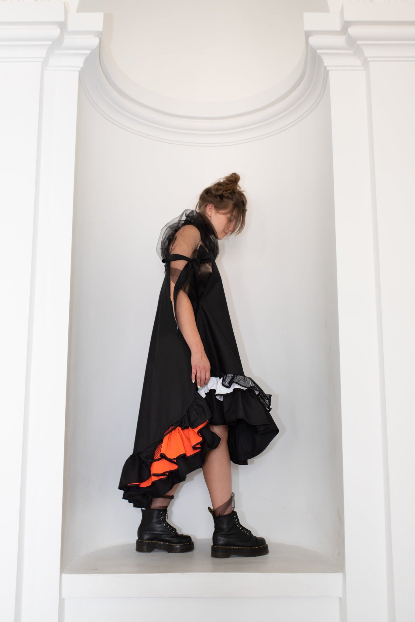 Black fronzi dress with orange details and frills