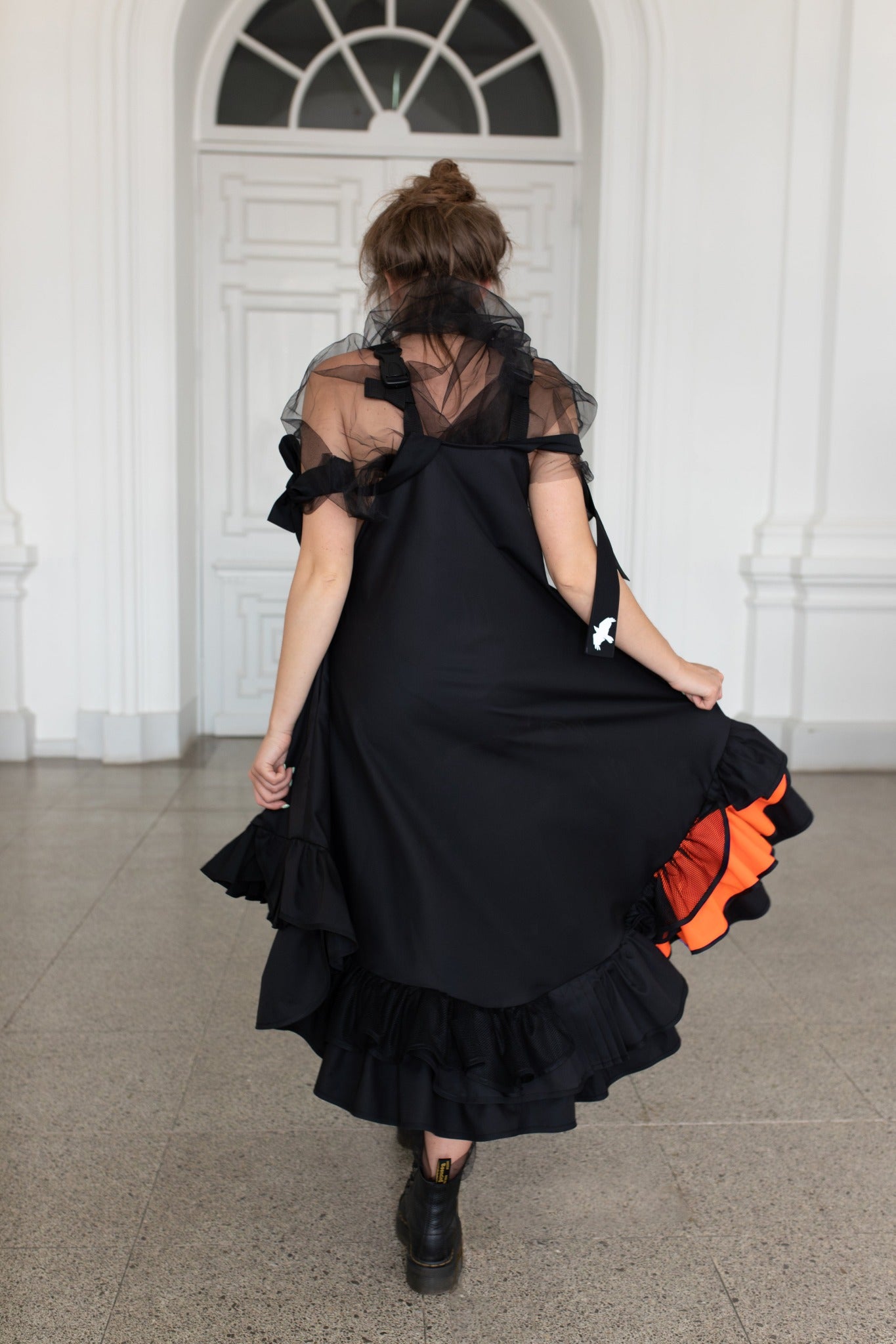 Black fronzi dress with orange details and frills