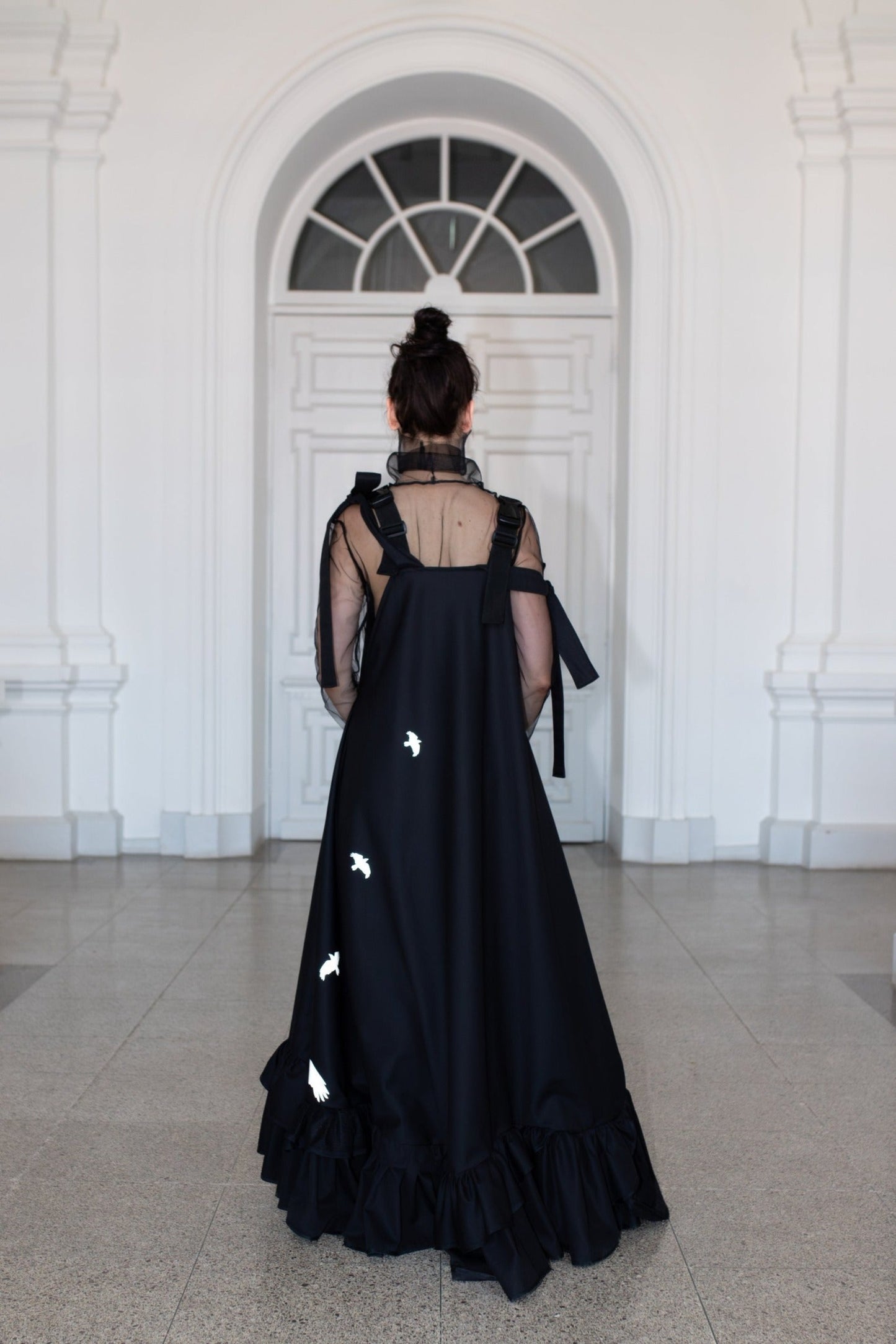 Long, black fronzi dress with reflective birds on the back