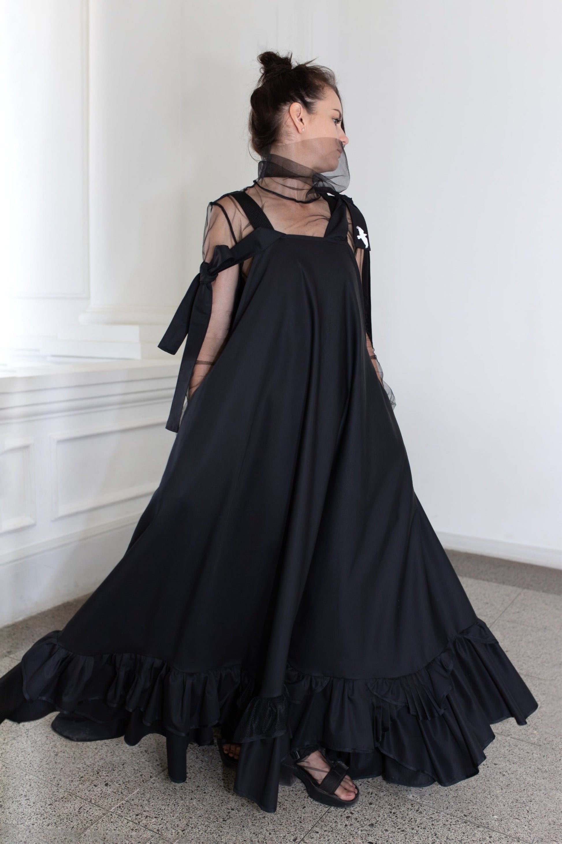 Long, black fronzi dress with reflective birds on the back