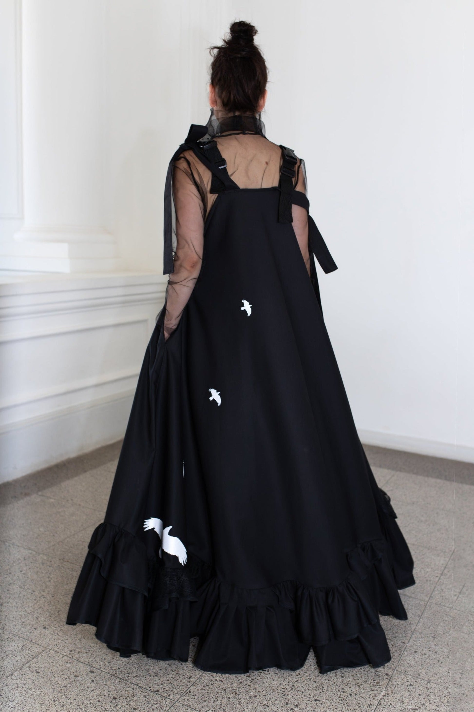 Long, black fronzi dress with reflective birds on the back