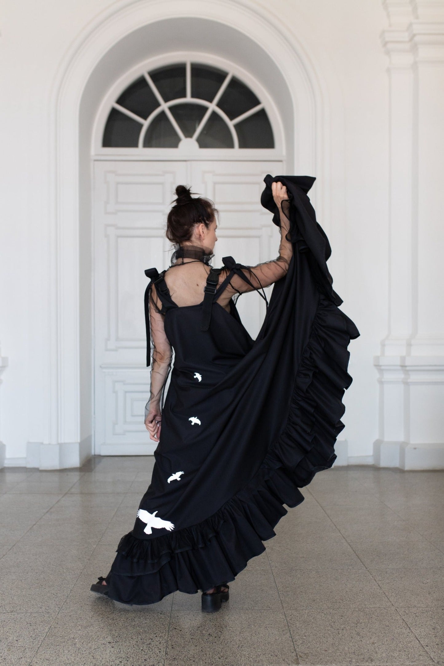Long, black fronzi dress with reflective birds on the back