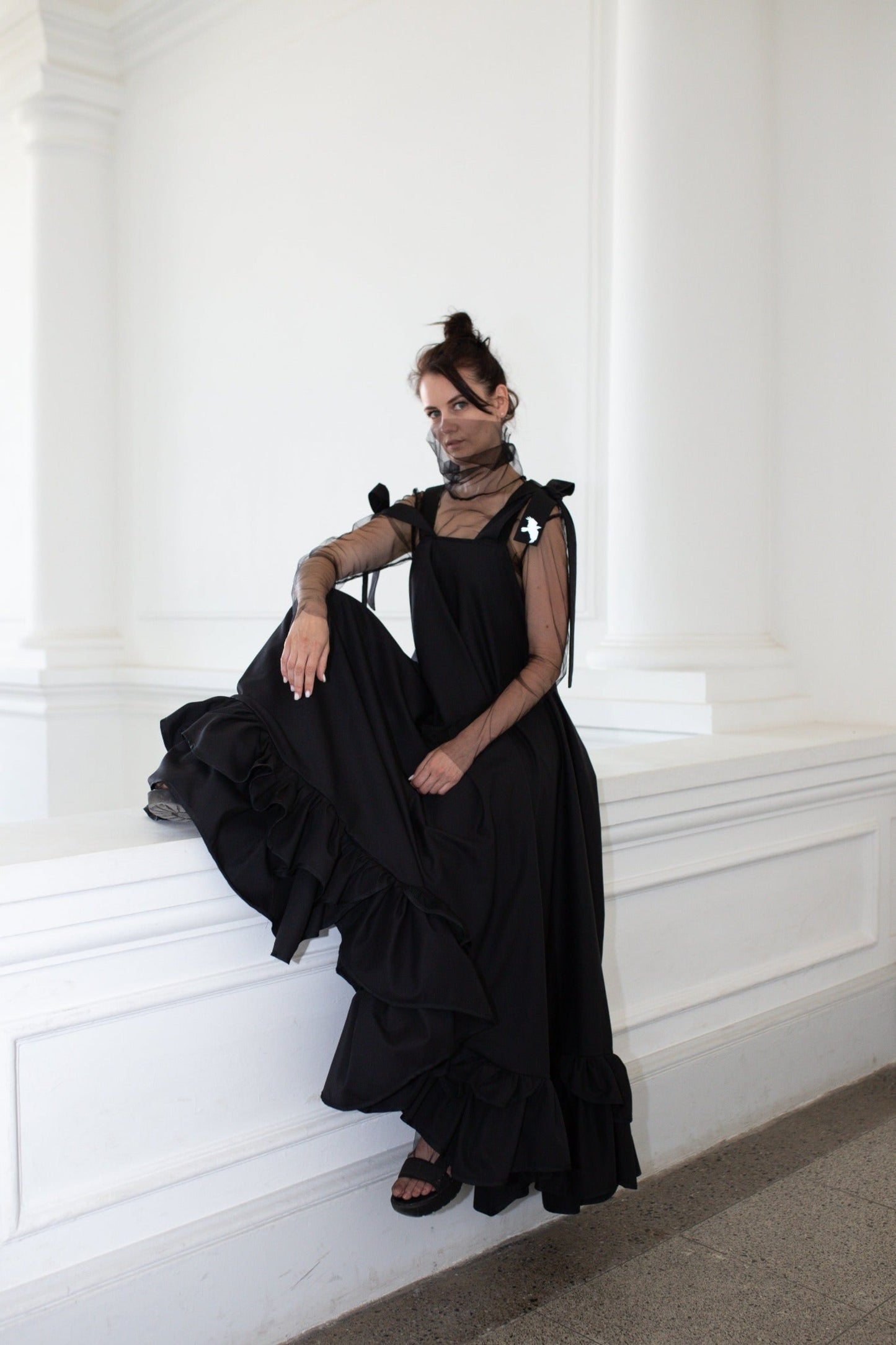 Long, black fronzi dress with reflective birds on the back