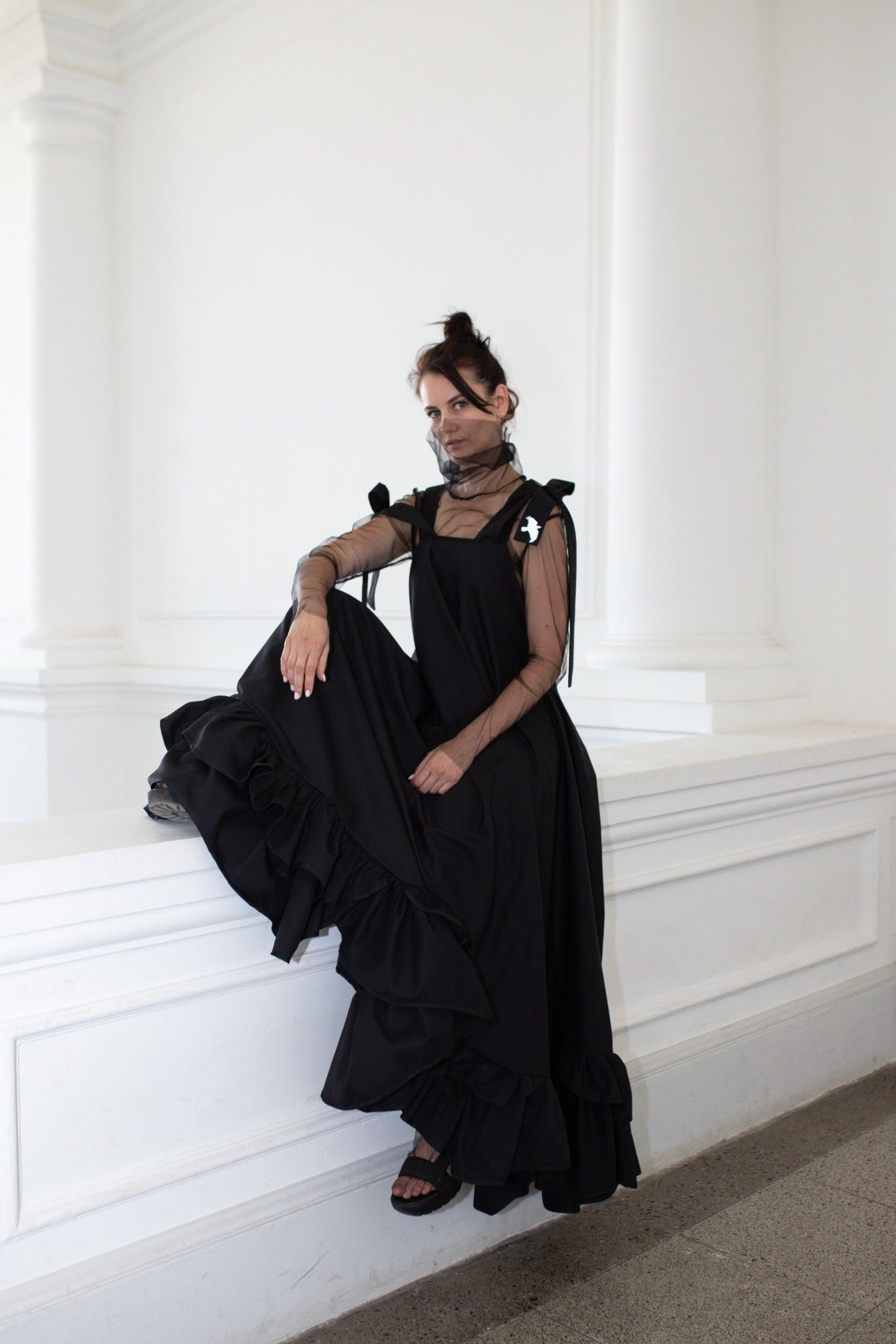 Long, black fronzi dress with reflective birds on the back