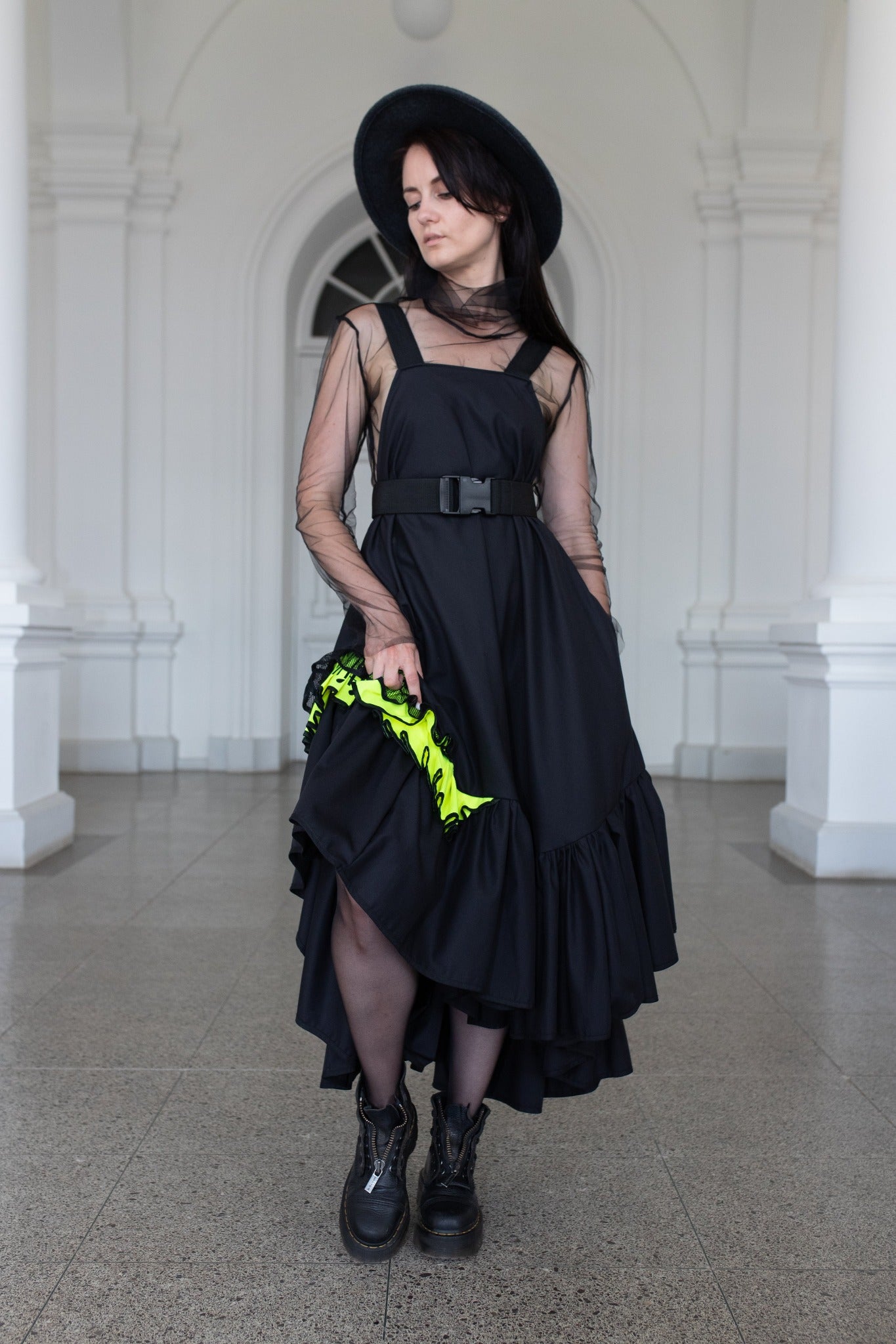 Long, black fronzi dress with neone details and frills
