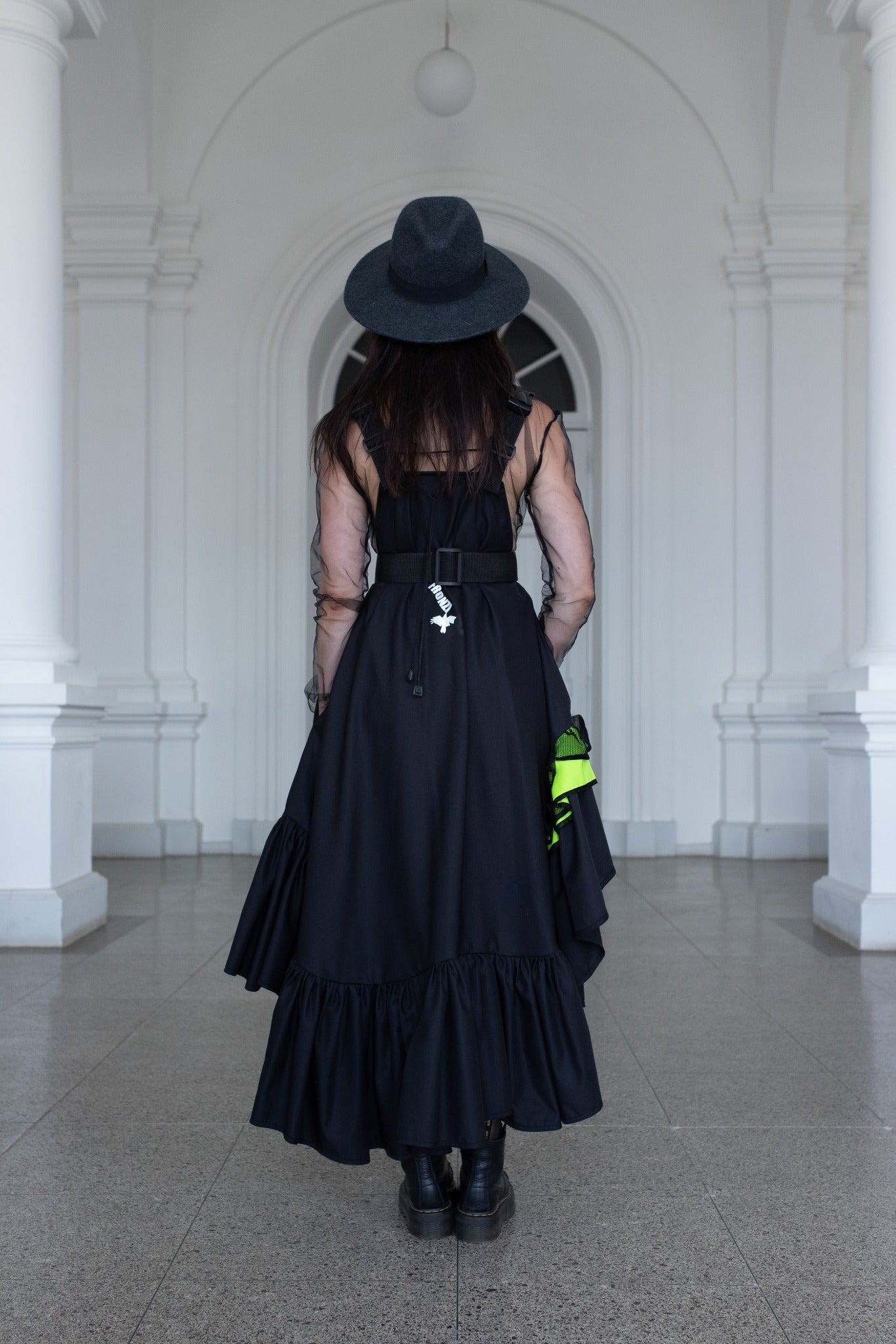 Long, black fronzi dress with neone details and frills