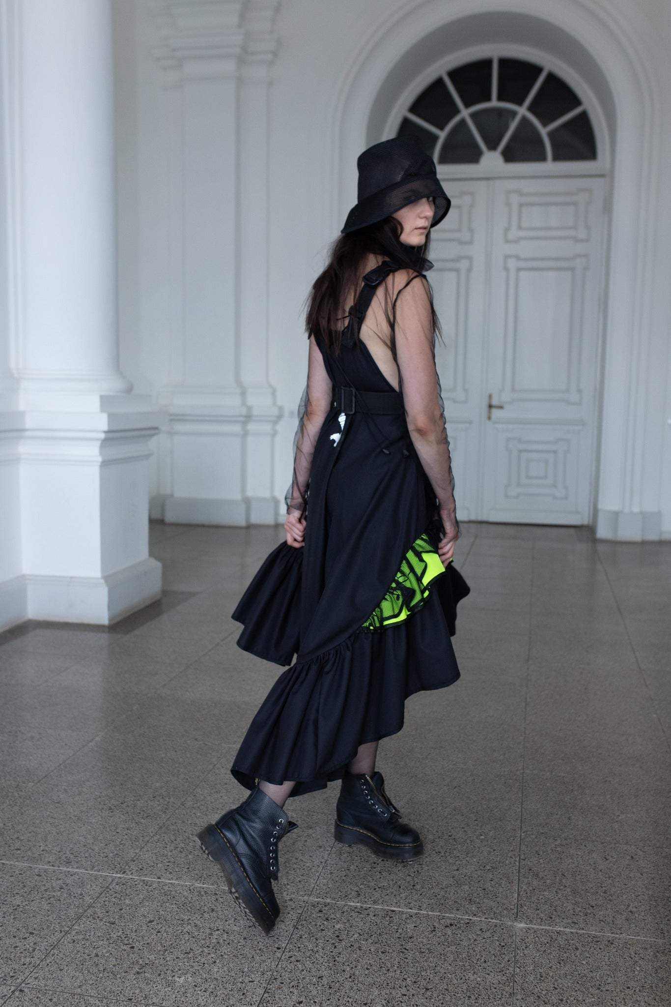 Long, black fronzi dress with neone details and frills