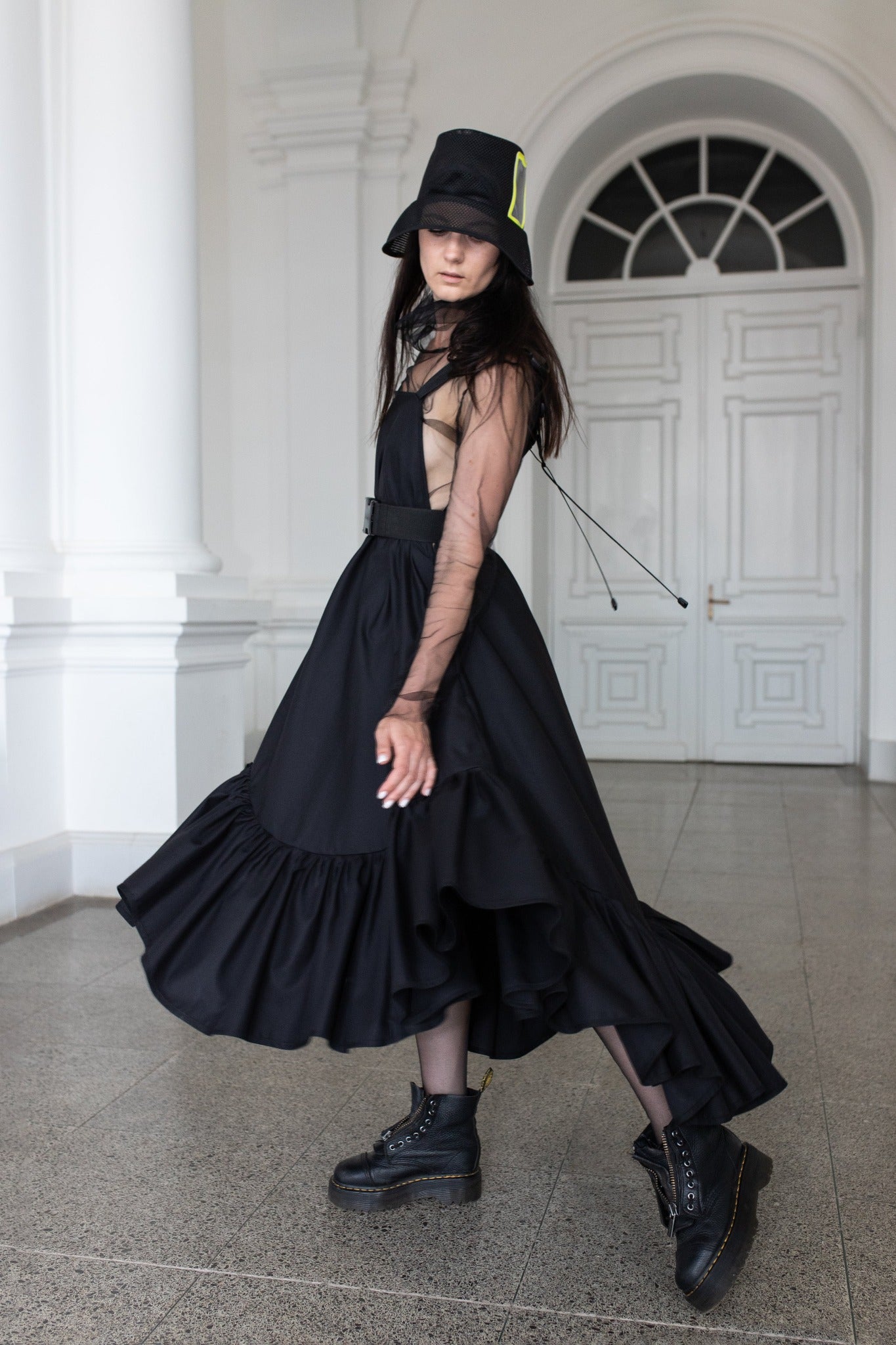 Long, black fronzi dress with neone details and frills