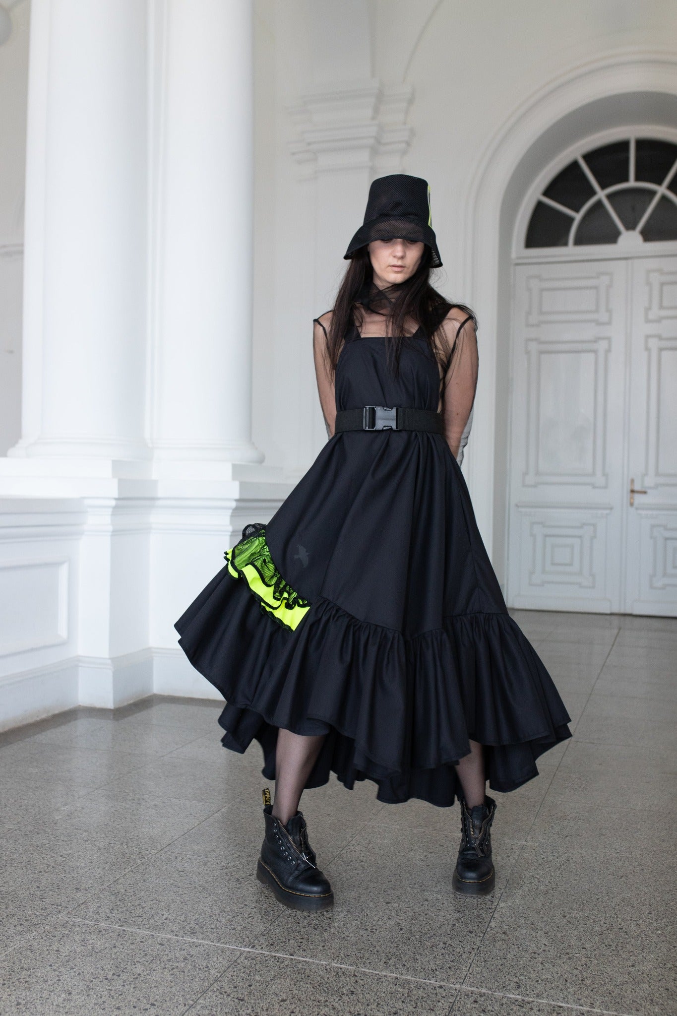 Long, black fronzi dress with neone details and frills