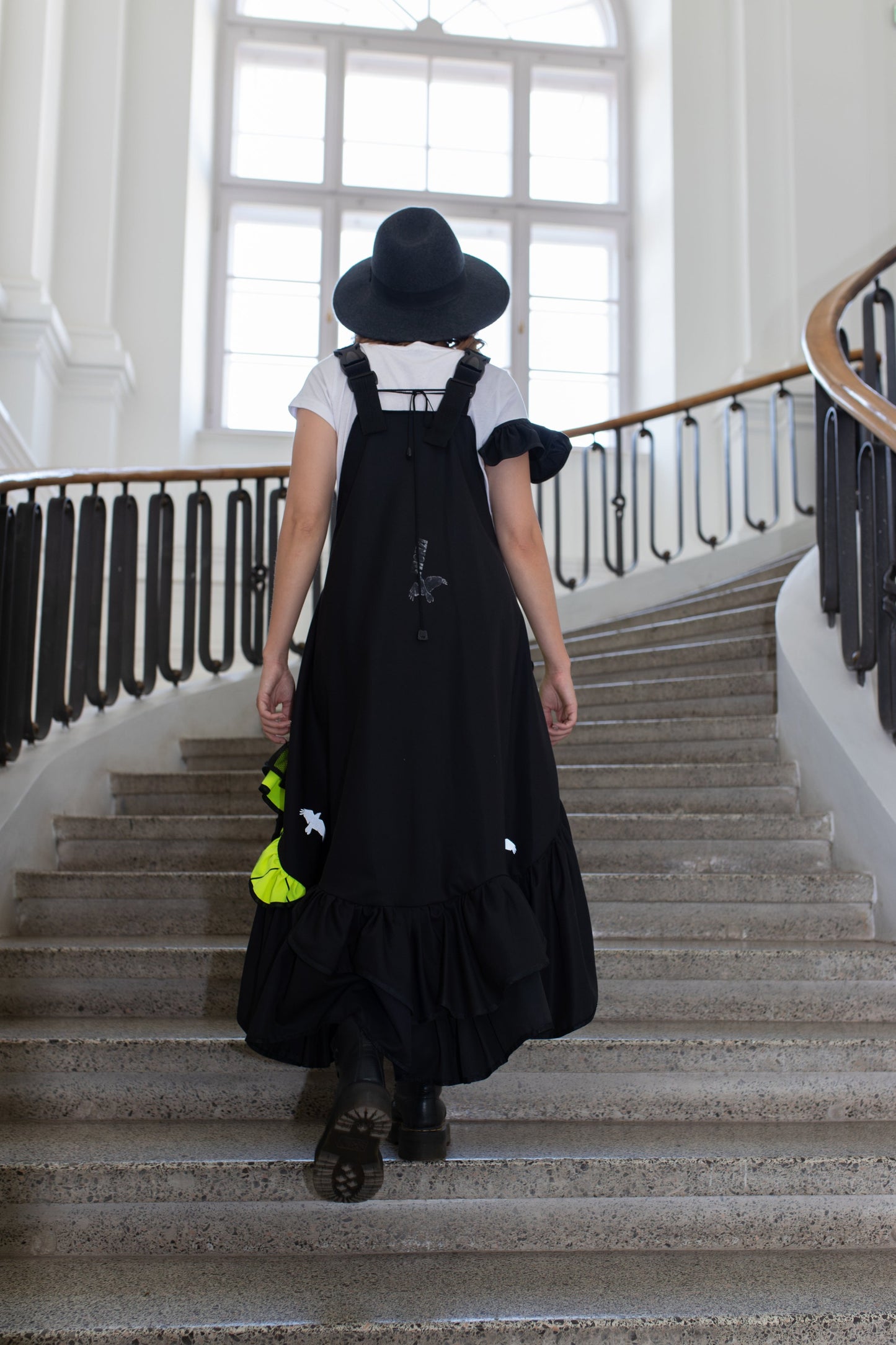Short, black fronzi dress with neon details and frills