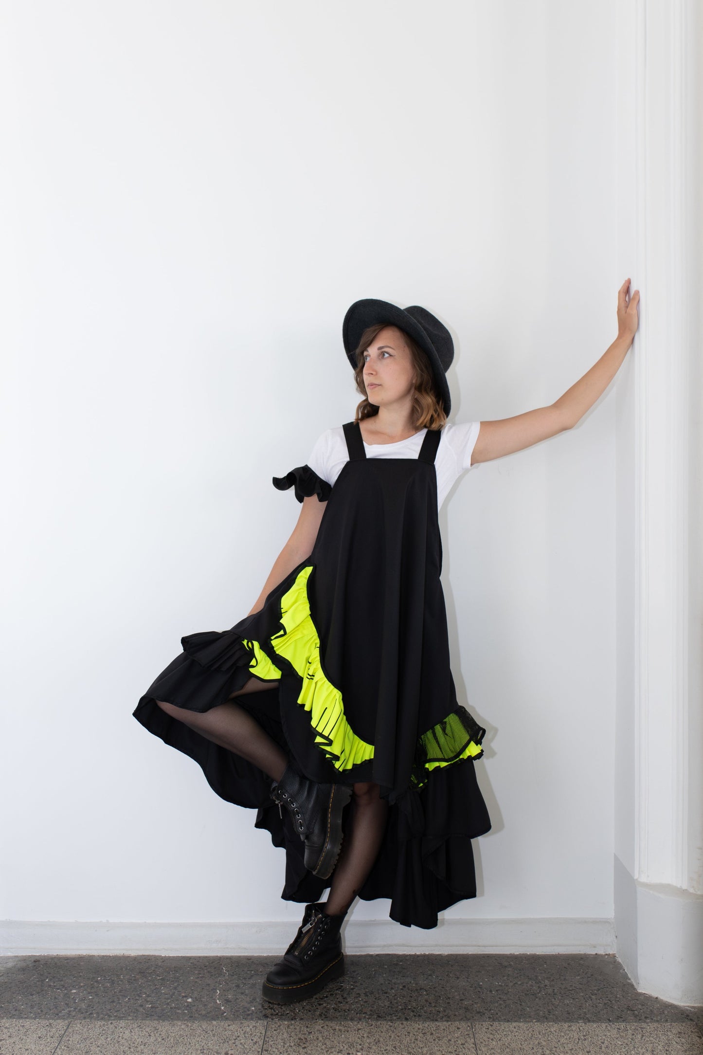 Short, black fronzi dress with neon details and frills