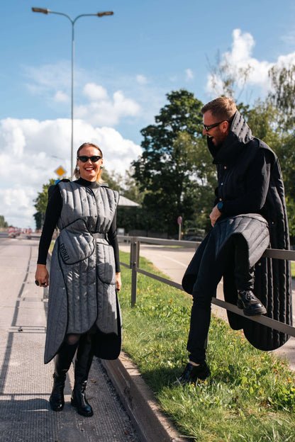 Man and woman laughing while wearing Fronzi long vests in grey and black