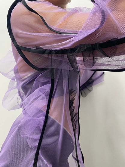 Close up to right sleeve details on purple see-through top