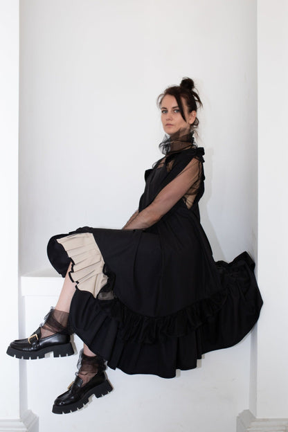 Black fronzi dress with frills and beige detail