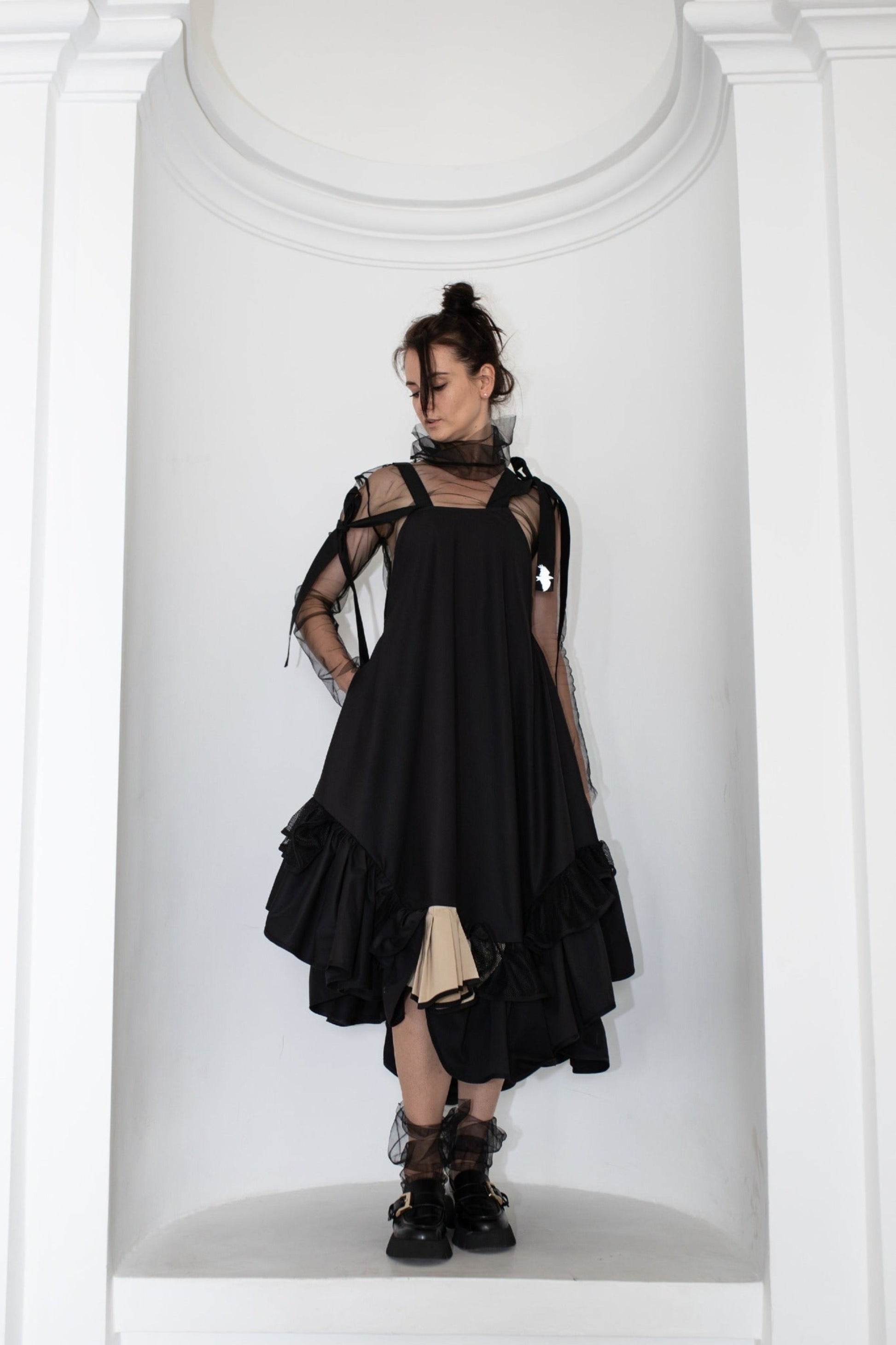 Black fronzi dress with frills and beige detail