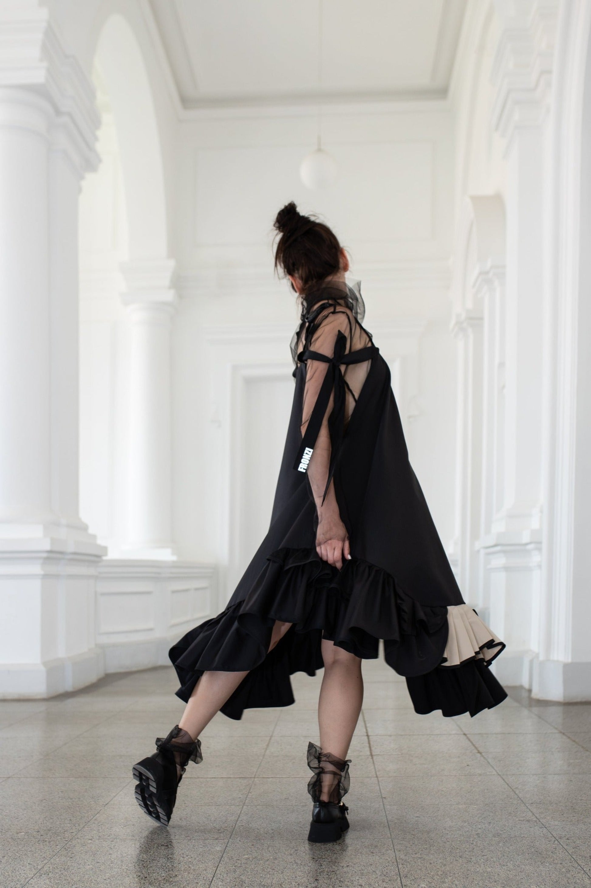 Black fronzi dress with frills and beige detail