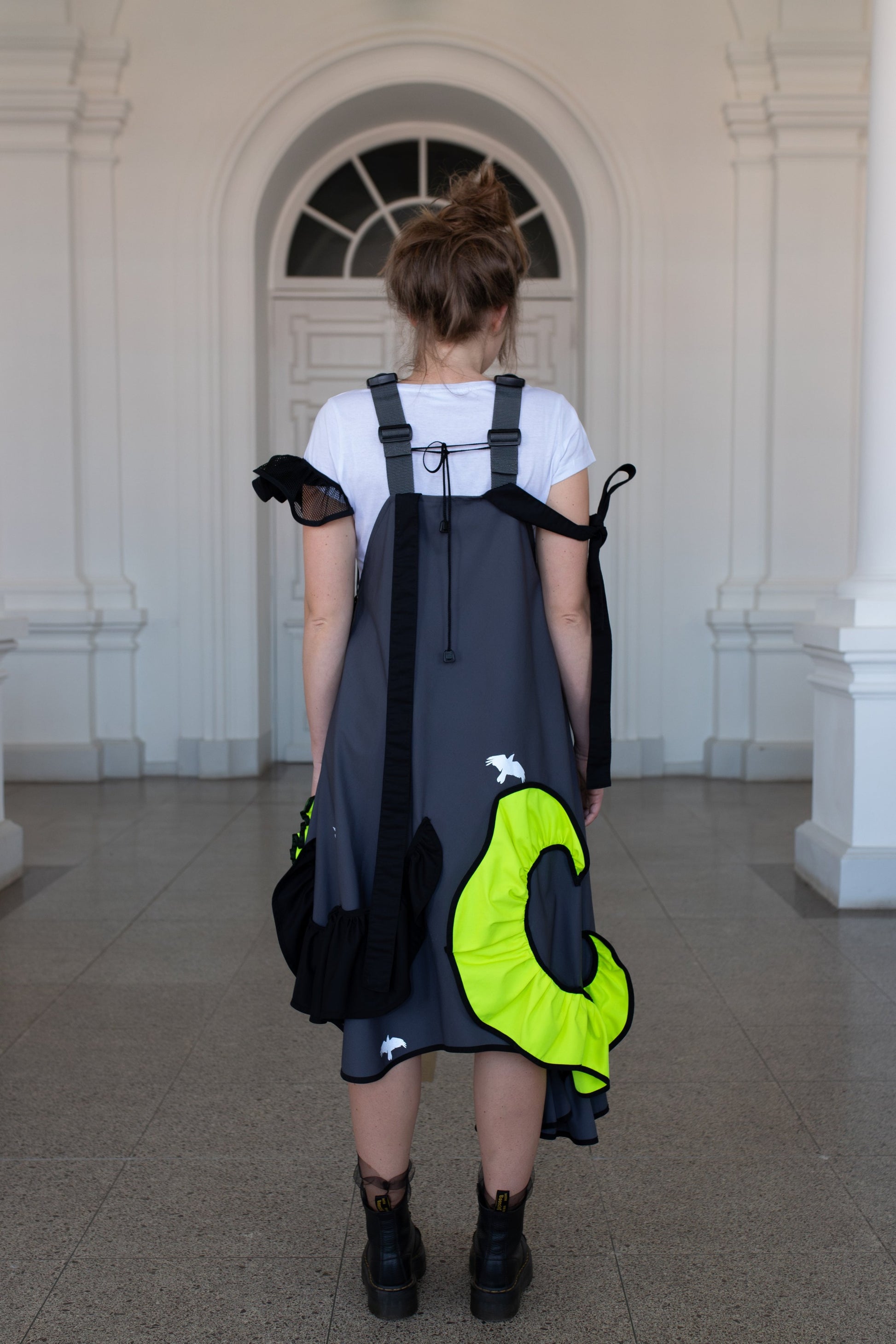 Grey fronzi dress with neon and black details and frills