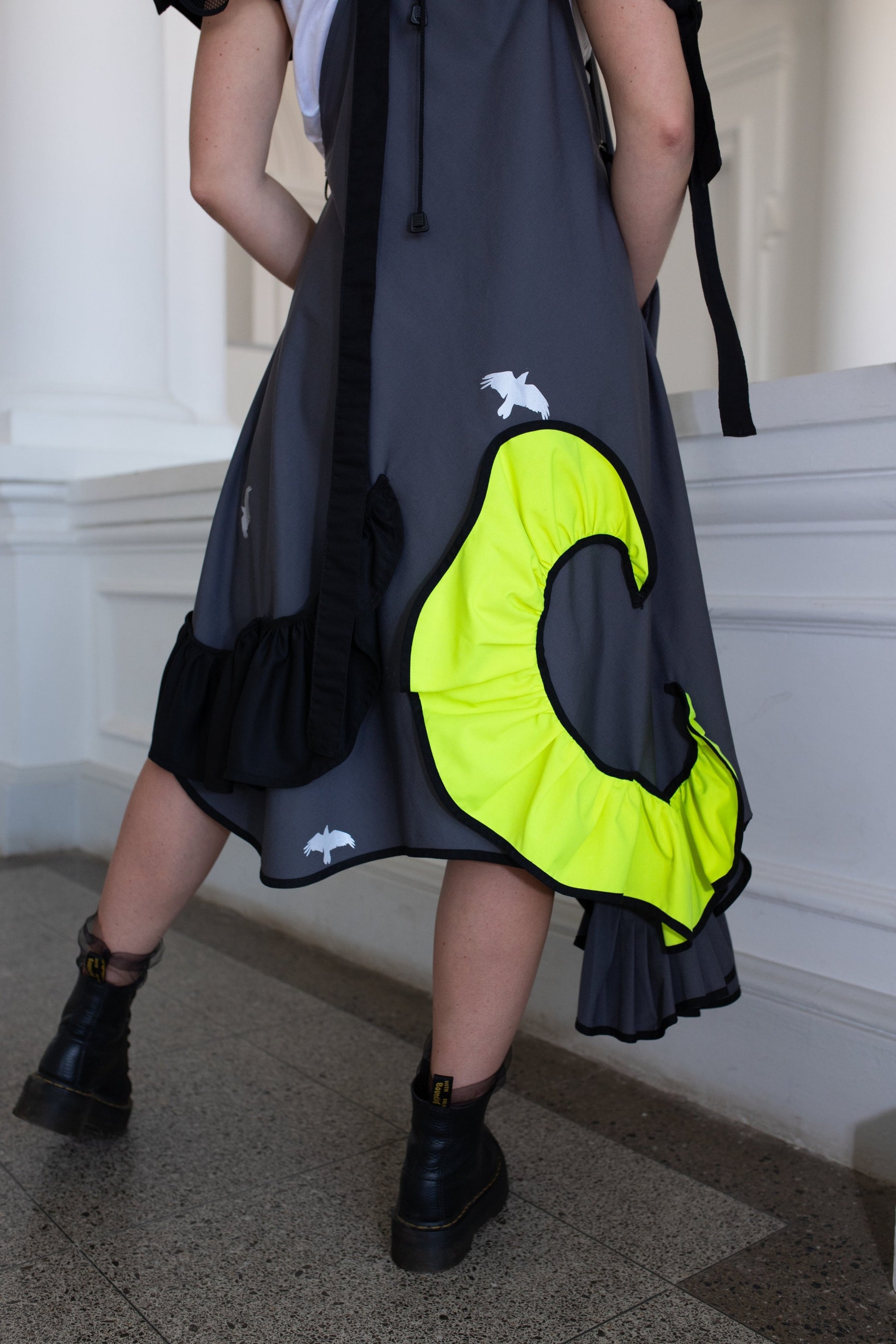 Grey fronzi dress with neon and black details and frills