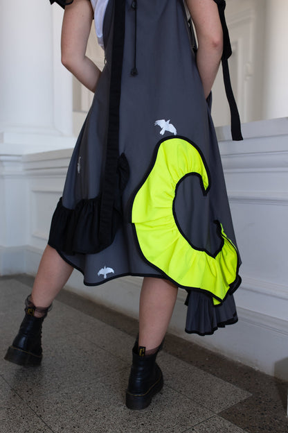 Grey fronzi dress with neon and black details and frills