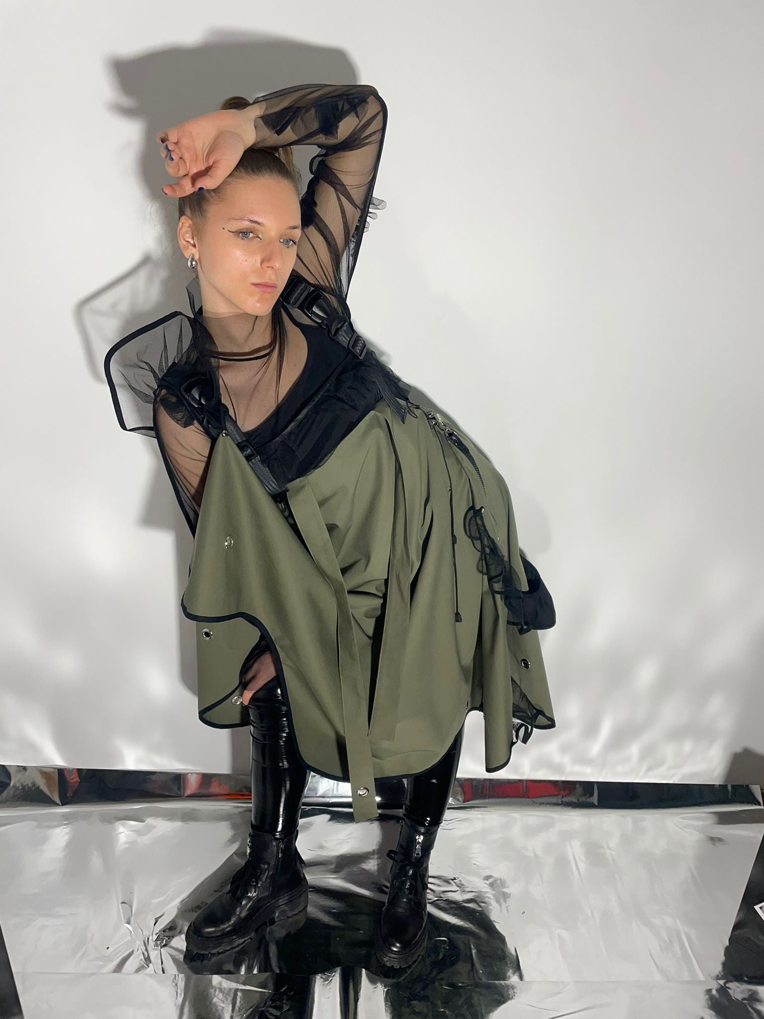 Model wearing a khaki color skirt that transforms into a dress