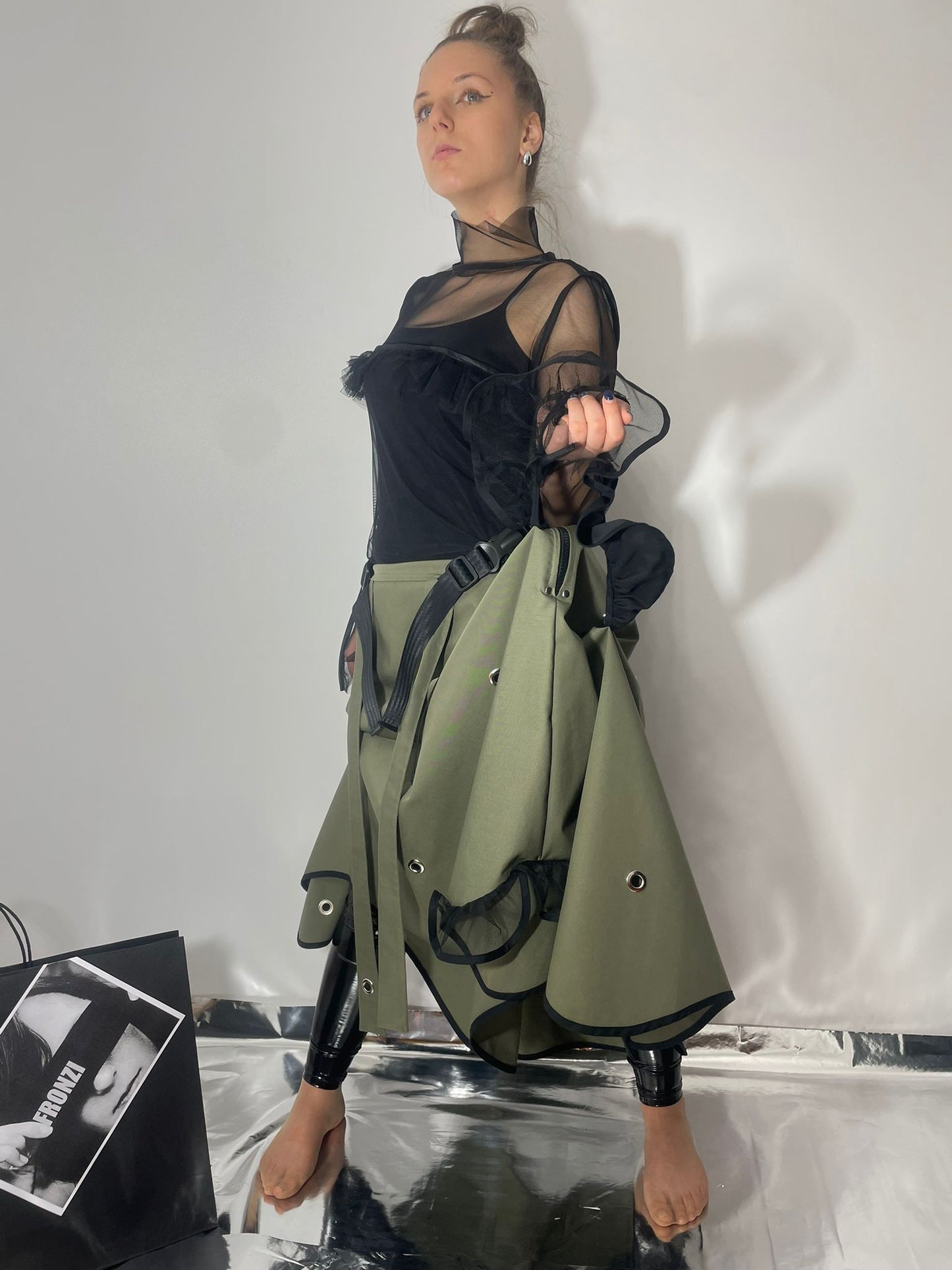 Model wearing a khaki skirt which can also be converted to a dress