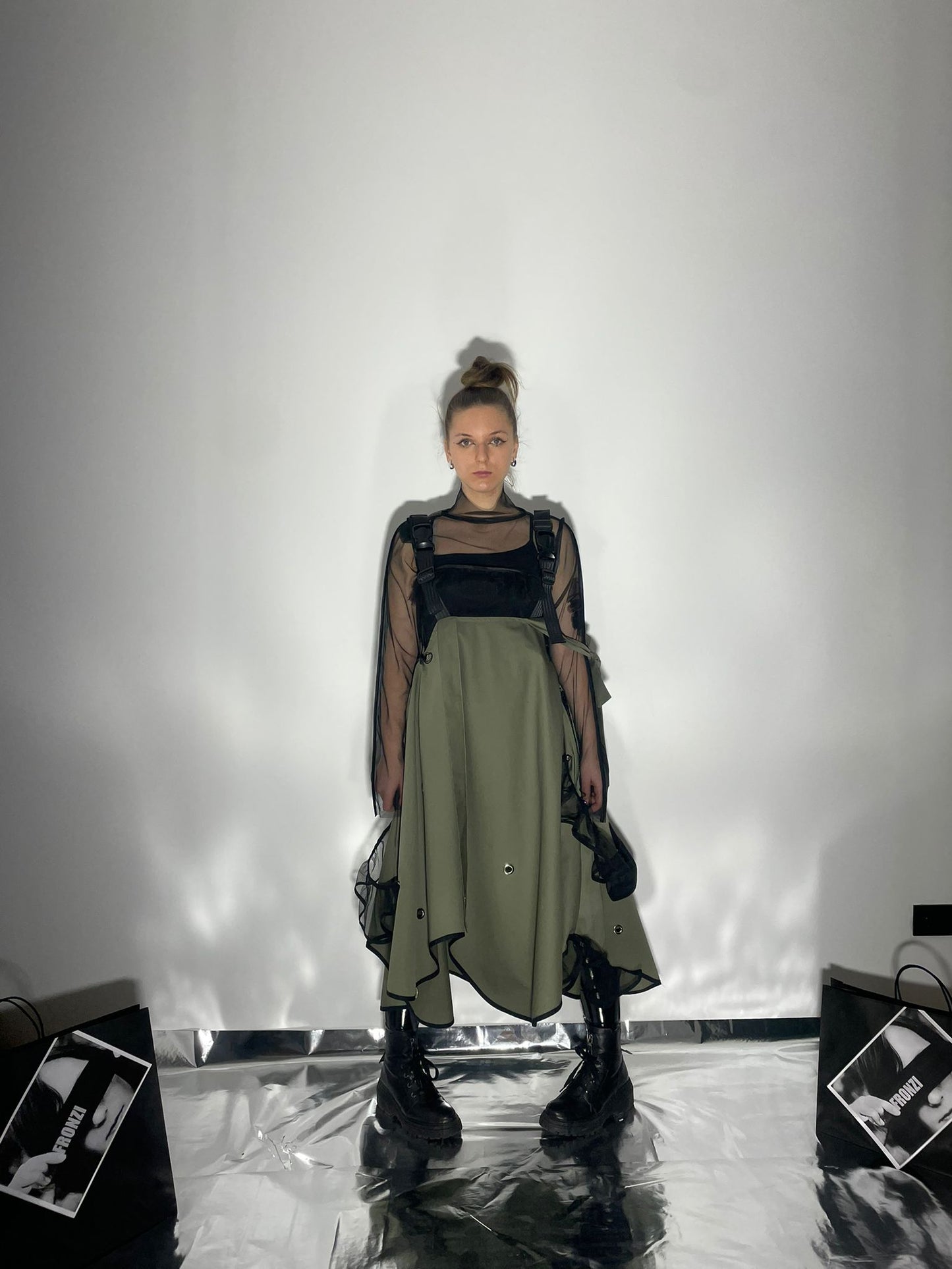 View from the front of model wearing a khaki color dress