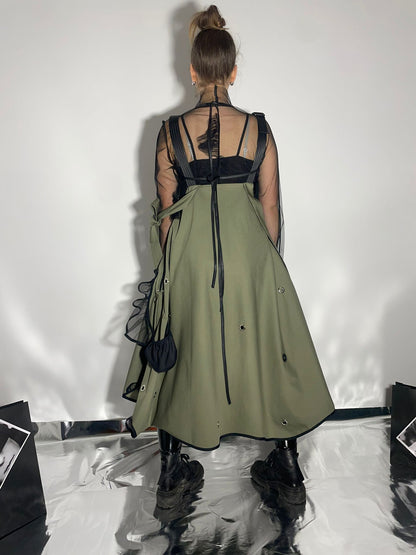 View from the back of a model wearing a khaki color skirt dress